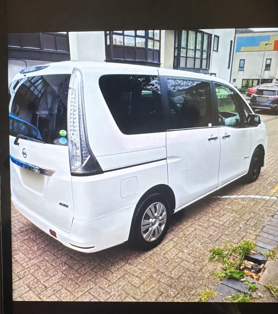White multi-purpose vehicle prepared for planned transport in North East London